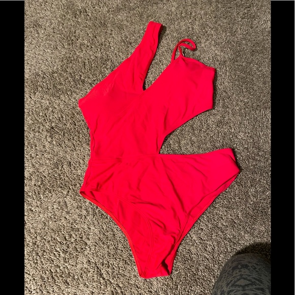 She in red cutout one piece - Picture 2 of 5